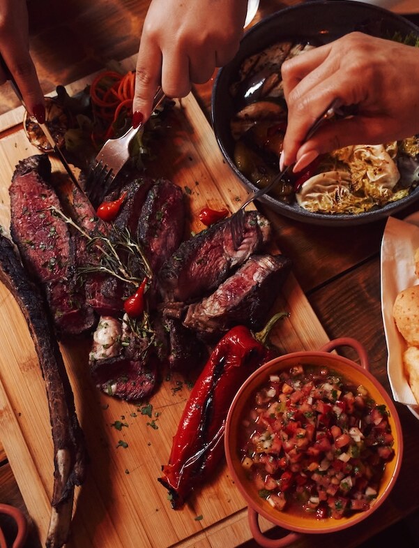 The three Brazilian women honouring churrasco tradition cooking over charcoal in Bermondsey