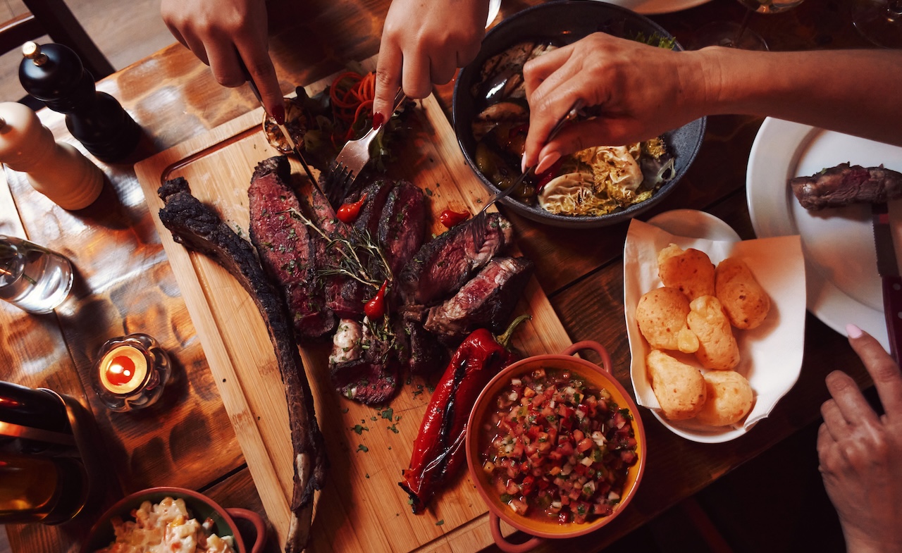 The three Brazilian women honouring churrasco tradition cooking over charcoal in Bermondsey